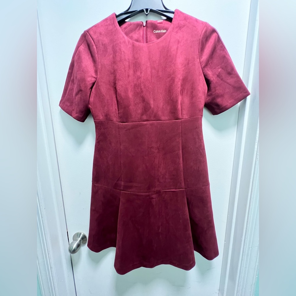 Calvin Klein dress gently used, burgundy color size 12. Polyester/spender